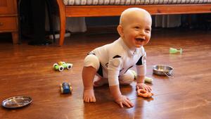 An infant wearing the MAIJU smart jumpsuit