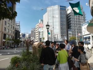 Koshiro (center, in back) leads a city walk event around the former foreign settlement in Kobe.