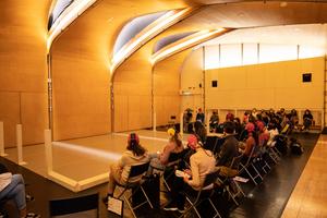 Audience in front of the stage at dance performance