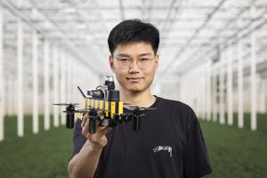 PhD candidate Dequan Ou with Bee-Nav drone