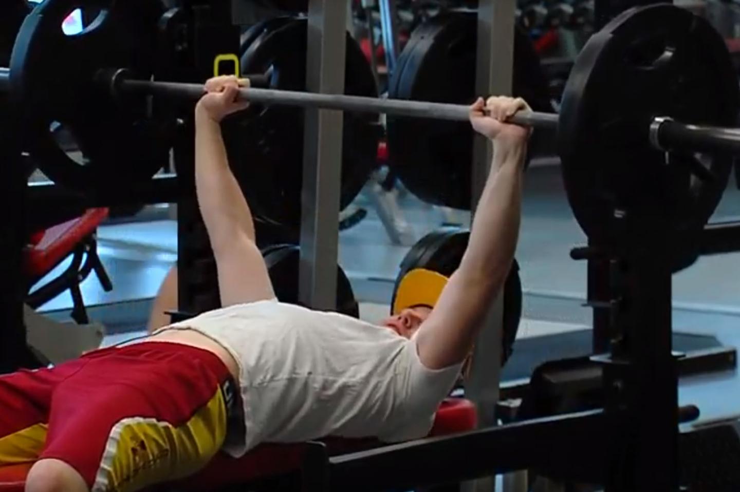 Man Bench Pressing Weights