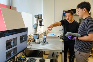 NTU Prof Hirotaka Sato working with NTU Project Officer Greg Angelo Gonzales Nonato on the automated cyborg insect factory prototype