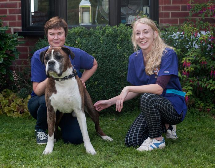 Boxer study participant with two of the study's authors