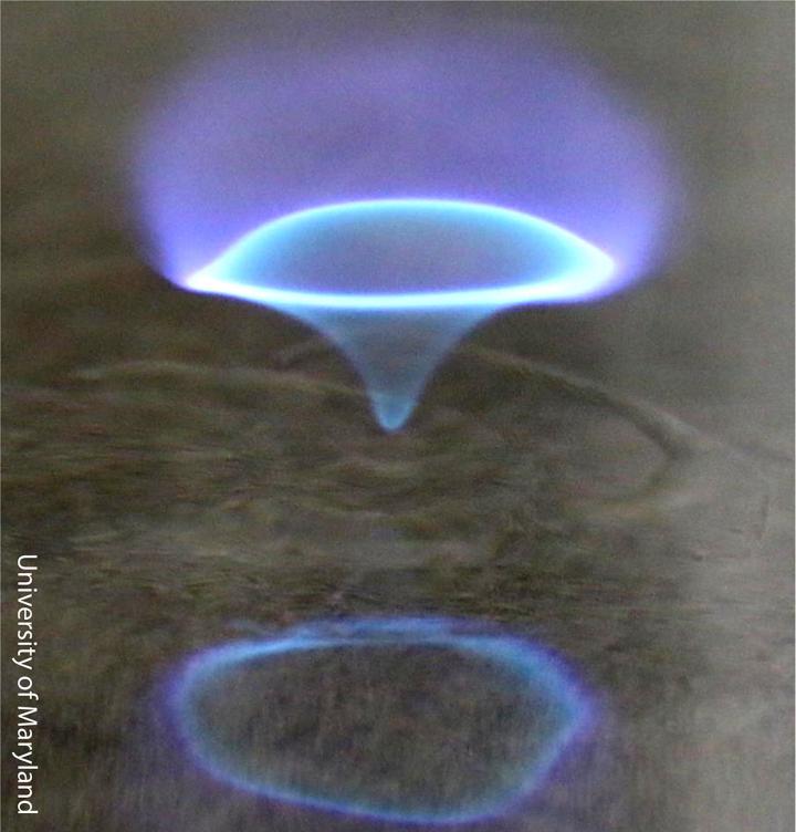A Blue Whirl over Water in a Swirl Generator