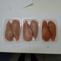 Transparent Containers Containing Chicken of Different Colors