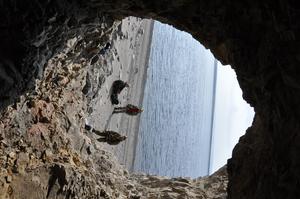 Team in cave at Arctic coast