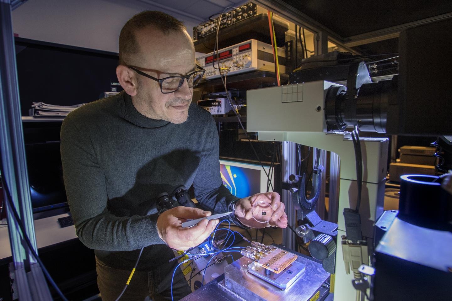 Mircea Cotlet Holding Photodetector