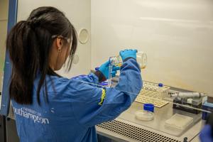 Researcher Michelle Lin preparing samples of bacteria and phages for study