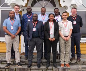 Group photo of project leader Kjell Arne Johansson with country team leaders and representatives