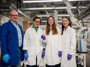Scientists standing in a lab