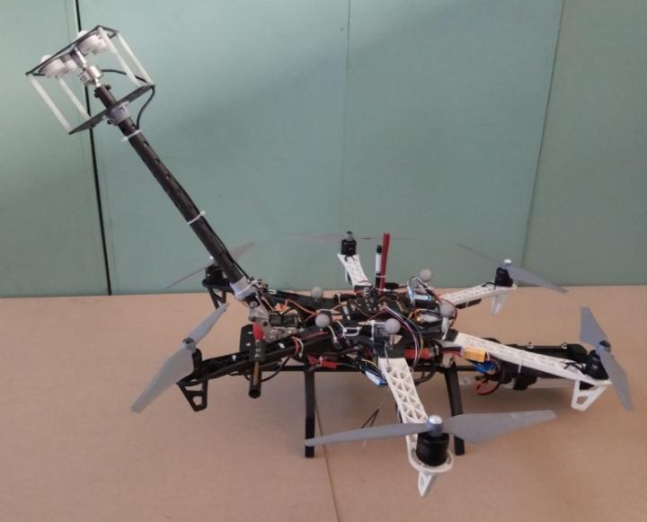The Contact Aerial Manipulator System