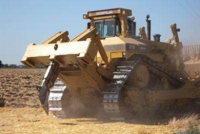 Tractor Uses a Soil-Ripping Shank