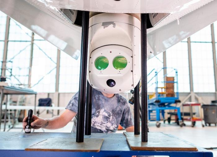 Free-space optical communications system installed on a small aircraft