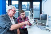 Planetologists with Meteorite