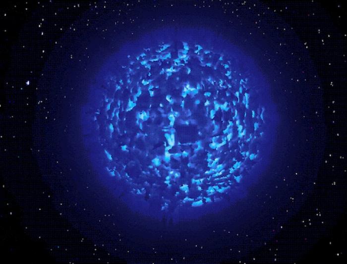 Computer simulation of the atmosphere and wind of a massive star