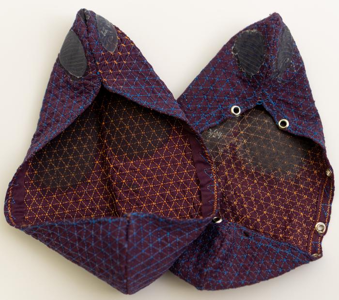 Pair of prototype footwear made from single embroidered textile pieces.