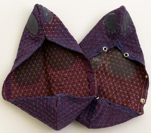 Pair of prototype footwear made from single embroidered textile pieces.
