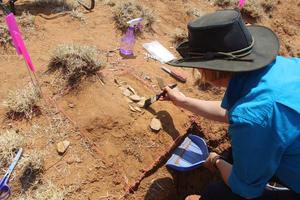 Dr Yinika Perston excavating the cache