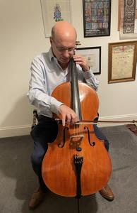 David Rubinsztein playing his cello, which he describes as his “most treasured possession.”