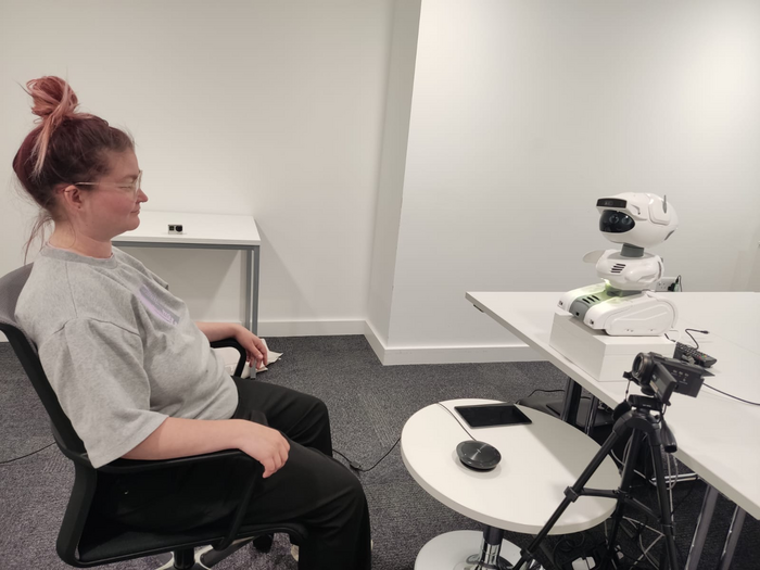 Person interacting with Misty II robot