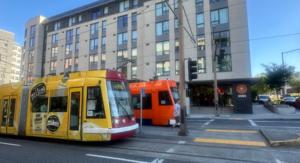 Portland Streetcar in front of Multifamily Building