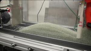 DynamiX in action, moving glass beads, around the instrument are three X-ray cameras to detect hidden movement inside the material.