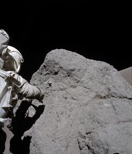 Apollo 17 astronaut sampling boulder at Station 7