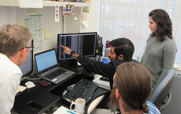 Karan Bedi explains the complex data analysis pipeline. Professor Ljungman is on the left