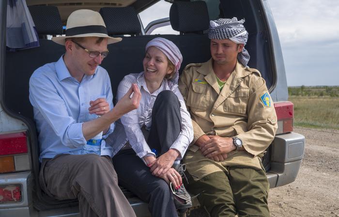 Dan Miljana and Ilya in the field vehicle on the site