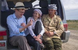 Dan Miljana and Ilya in the field vehicle on the site