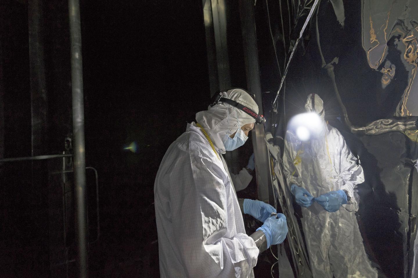 Technician Checks Helium Shroud Around Webb