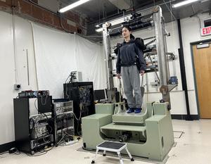 Participant standing on body-swap balance robot