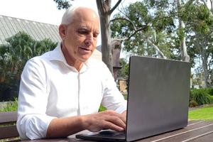 Norman Wildberger at his laptop.