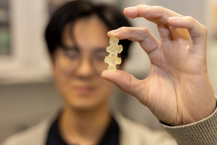 Researcher with Sclerite Model