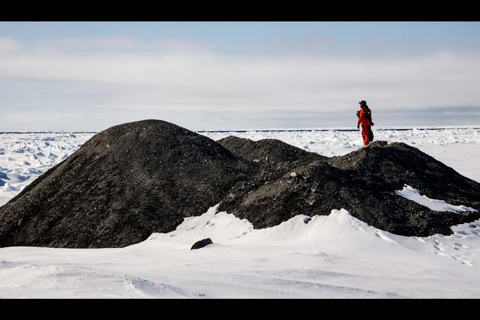 Researchers on an iceberg