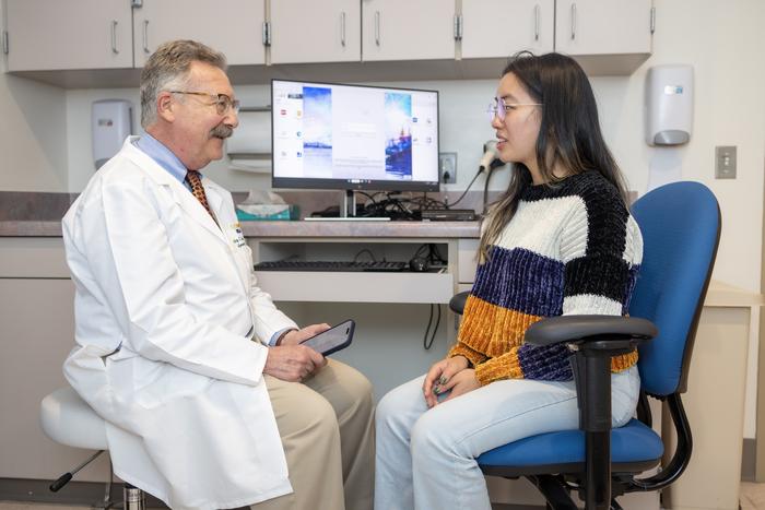 Doctor meets with patient using AI scribe