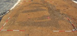 Excavated remains of a stone building with an apse