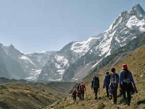 Field team walks towards Kyzylsu Glacier in Pamir mountains