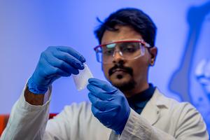 researcher holding sample