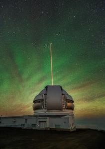 The Gemini North telescope’s laser guide star beams up into the atmosphere