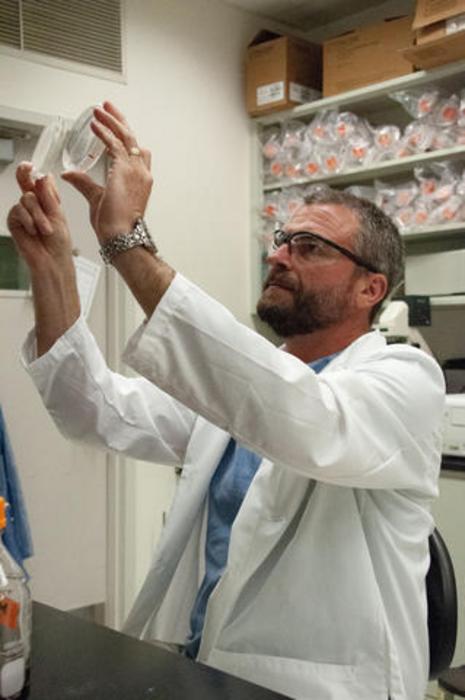 Scott Jackson researching poop