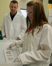 Graduate Student Doing Experiment