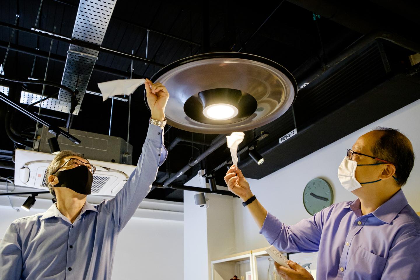 Demonstrating the dual airflow generated by the Vortec fan