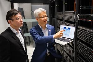 NTU Prof Wen Yonggang (right) and co-author Prof Ong Yew Soon (left), in a conventional data centre