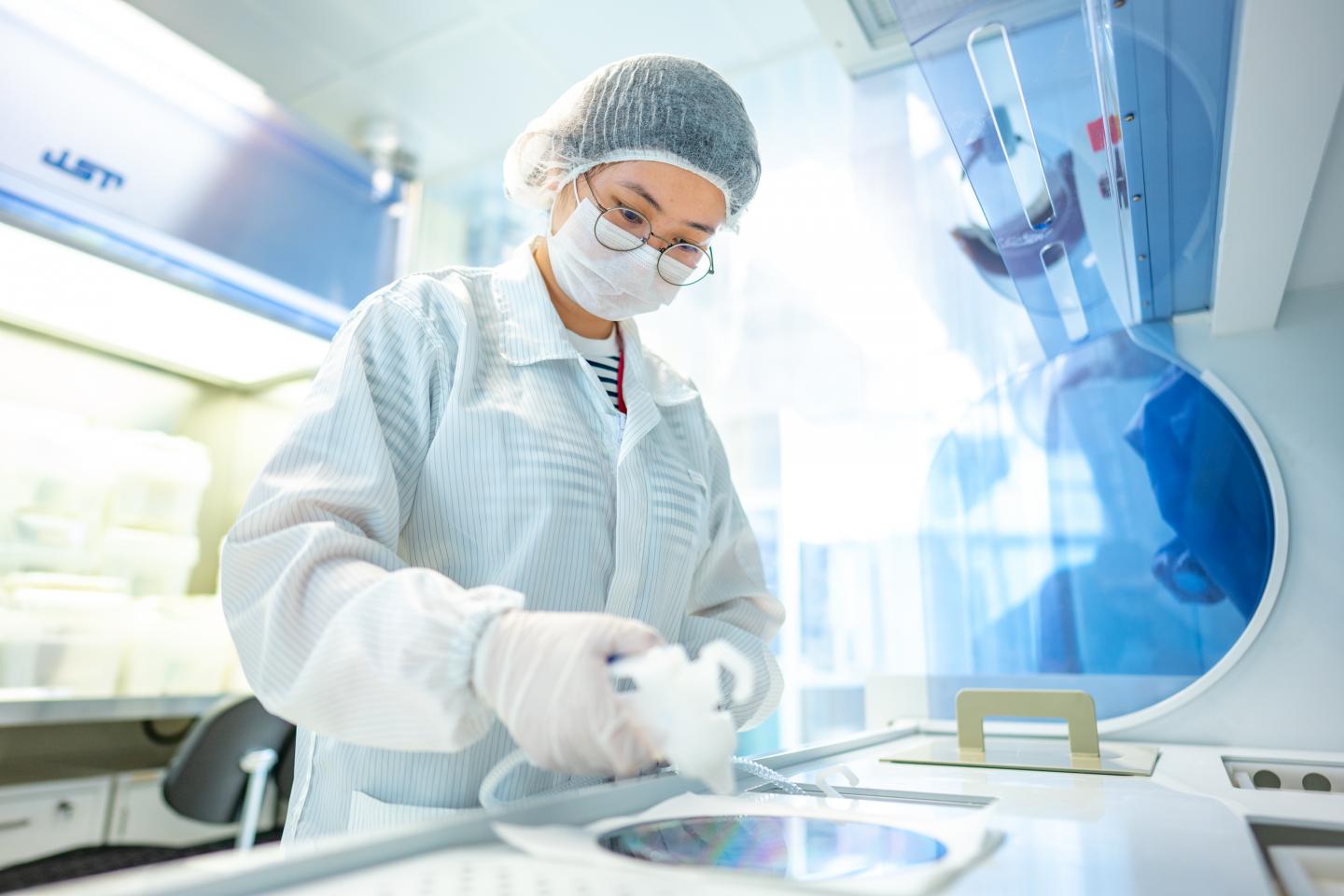 LEES Researcher Reviewing a 200 mm Silicon Iii-V Wafer