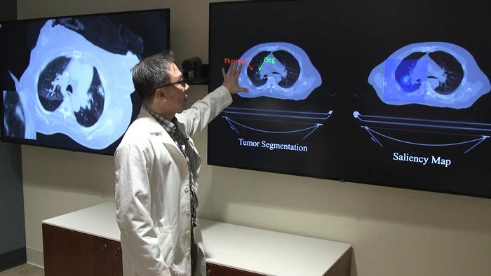 Study author Troy Teo shows how the AI tool contours a lung tumor as it moves with each breath