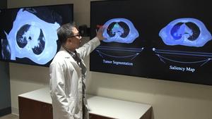 Study author Troy Teo shows how the AI tool contours a lung tumor as it moves with each breath