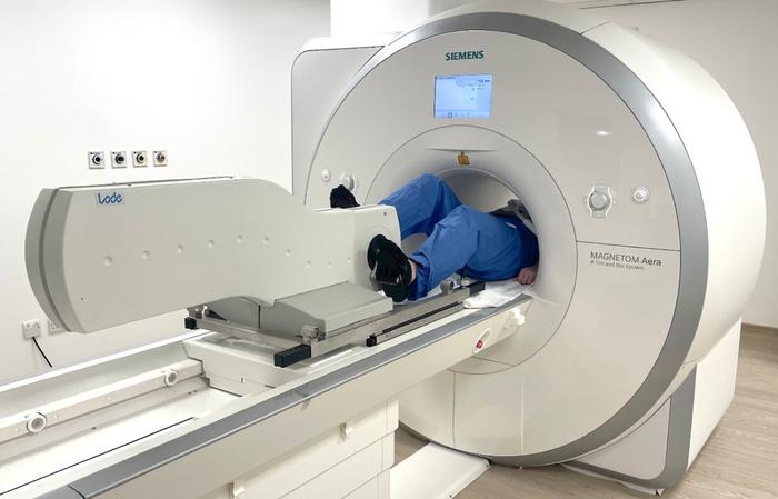 Person pedalling inside MRI machine