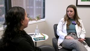 Study senior author Andrea Russell speaking to a nurse