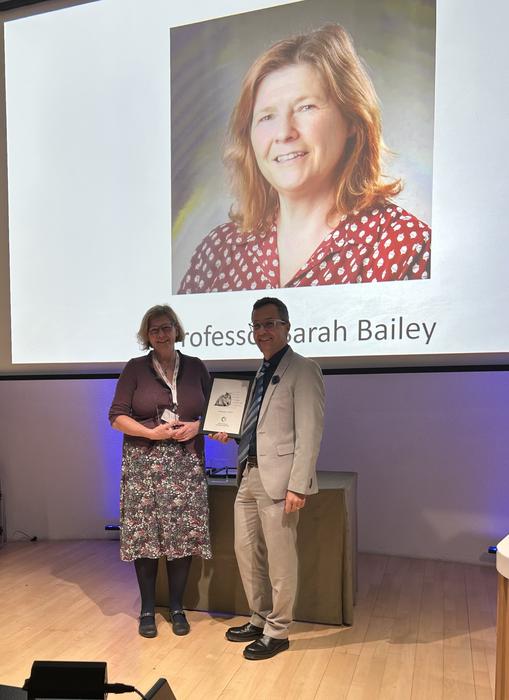 Professor Bailey being presented the award by Professor Chris Petkov, Chair of UAR
